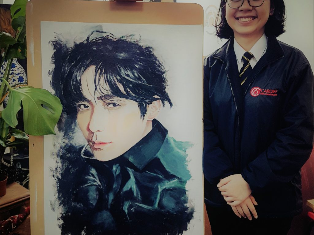 a student from a private school in Wales with her painting