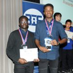 students from a private school in wales holding their awards