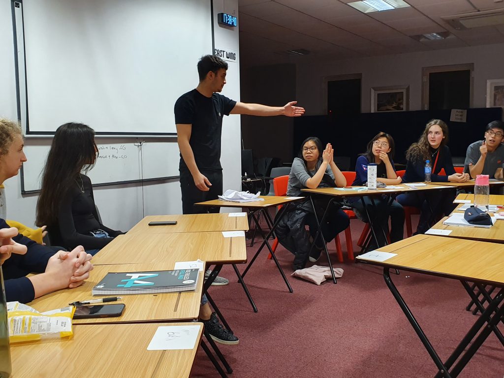 debate club taking place at a sixth form college in Cardiff