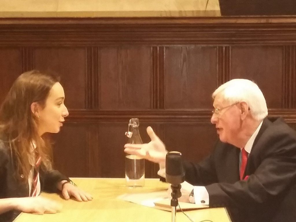 girl talking to a man across a table