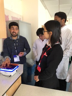 teacher demonstrating how to use equipment