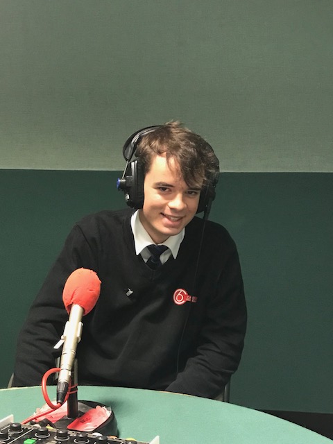 Student wearing headphones and microphone