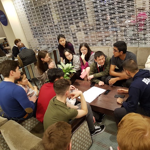 students waiting at a table