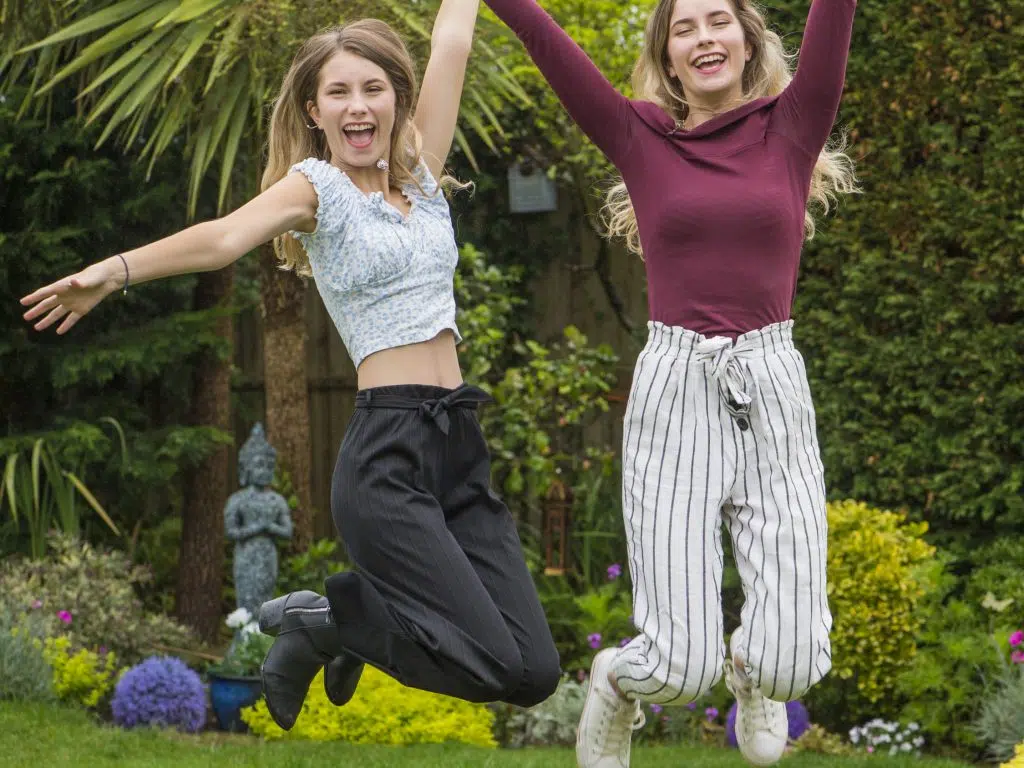 students from a private school in Cardiff cheering with their exam results