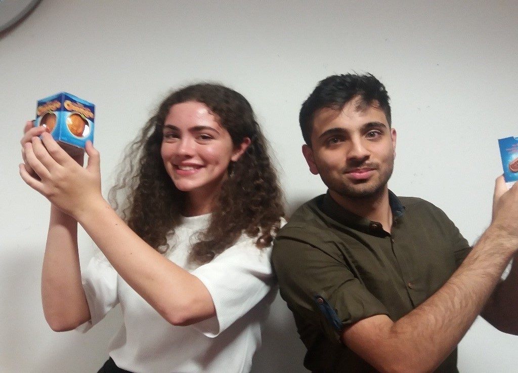 Boy and girl holding a box of Terry's chocolate orange