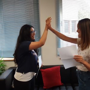 students high fiving